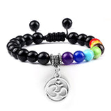 Bracelet Chakra en Perles Noires Brillantes avec Symbole Aum Argenté Réglable