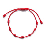 Bracelet rouge à sept nœuds