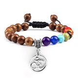 Bracelet Chakra en Perles de Bois avec Symbole Aum Argenté Réglable